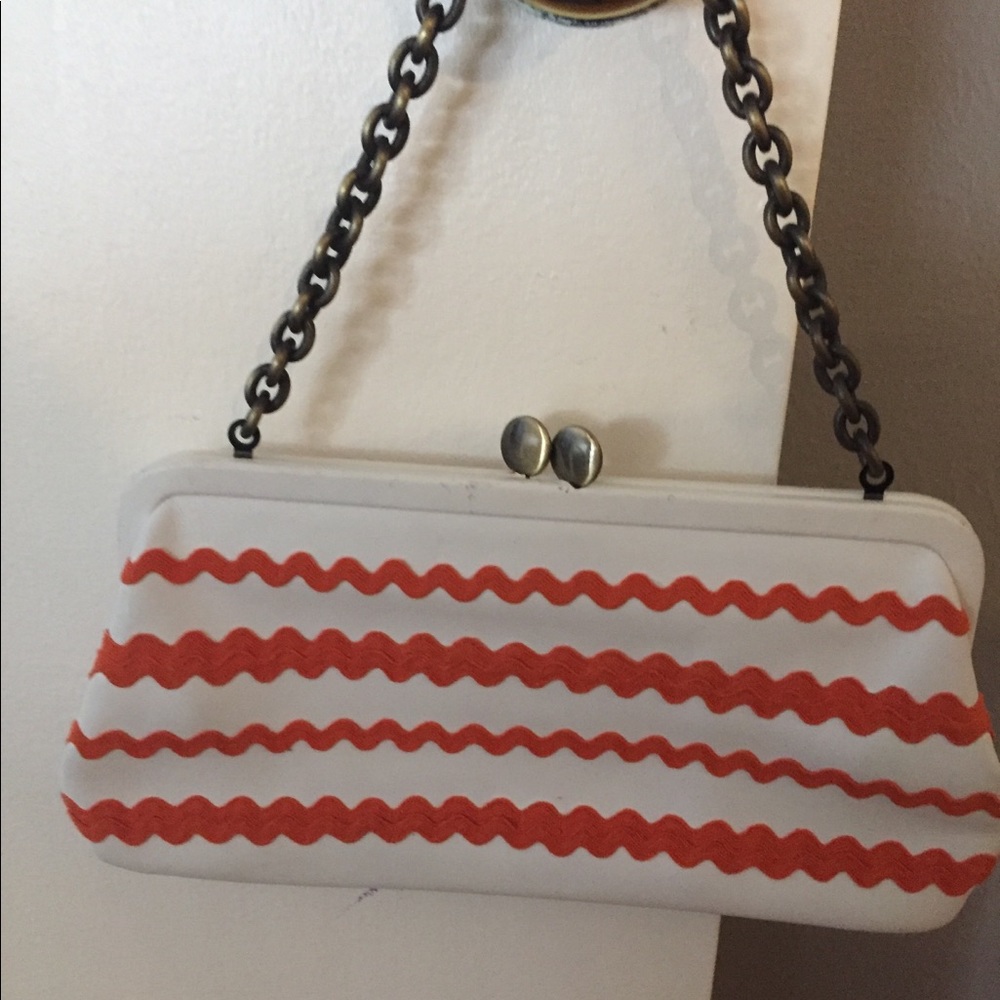 Cynthia Rowley clutch. White with orange zigzag.